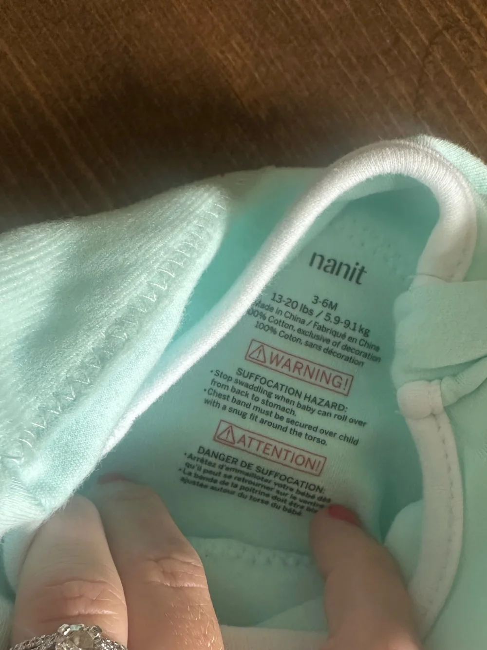 Nanit Mint Green Baby Swaddle with Black Geometric Accent
